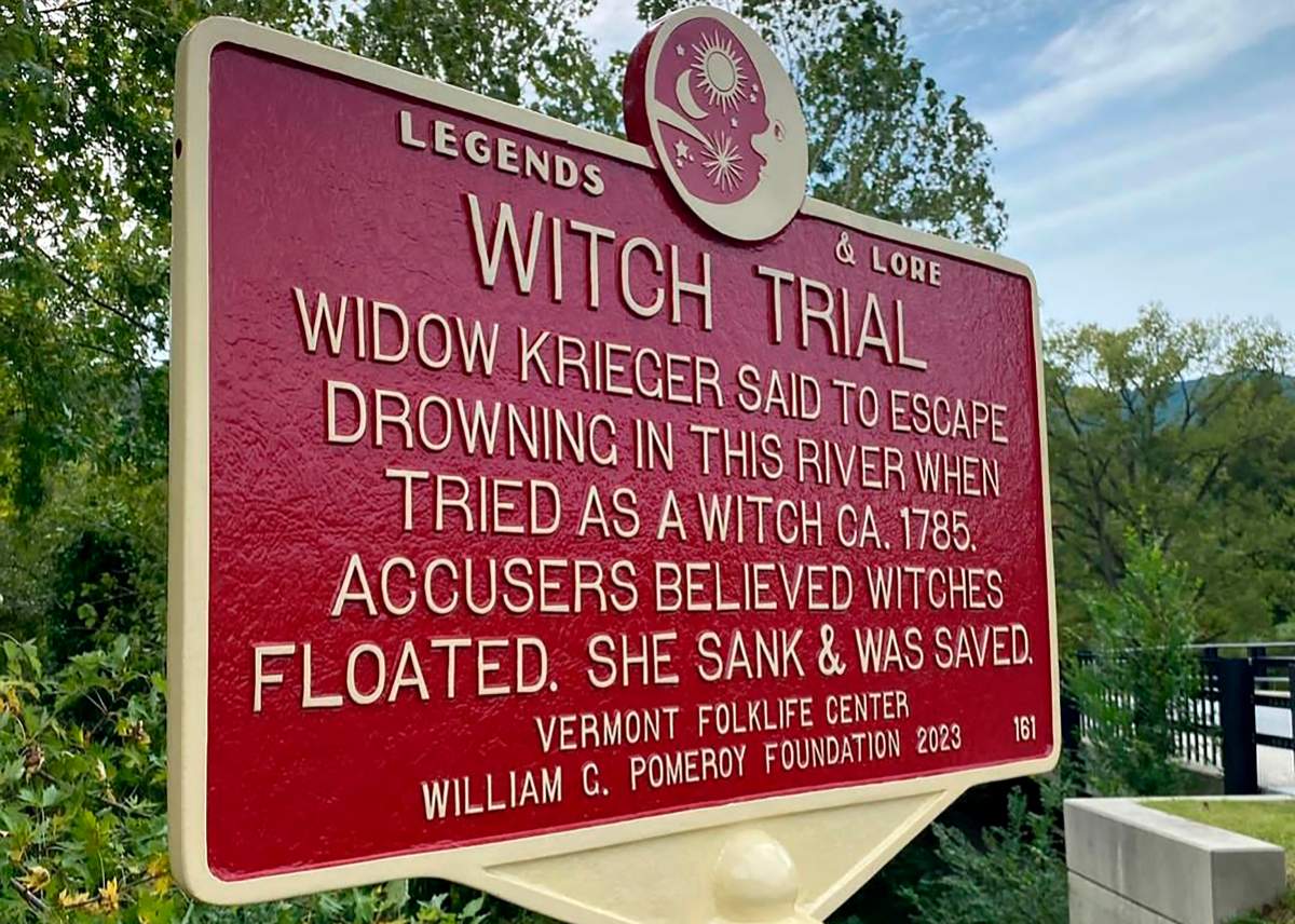 In this Sept. 2023 photo, provided by Alexina Jones, a newly installed marker, in Pownal, Vt., recognizes the survivor of Vermont's only recorded witch trial. Widow Krieger was said to have escaped drowning in the Hoosic River when tried as a witch in 1785, according to the Legends and Lore marker.