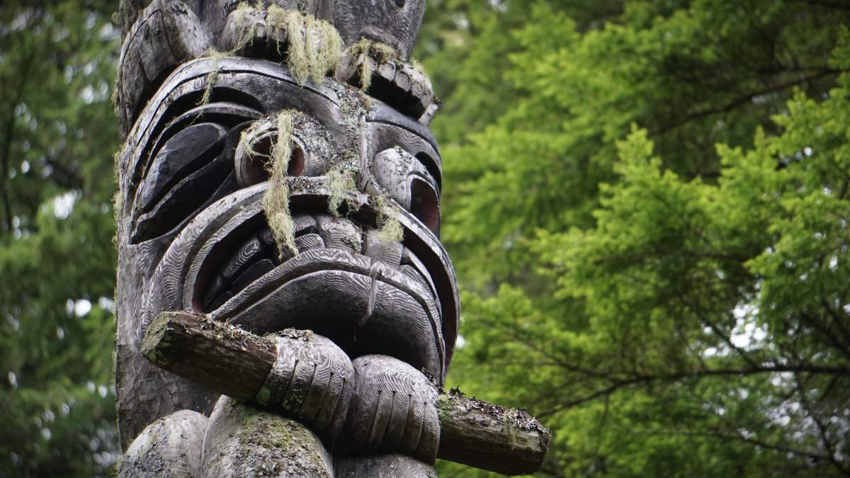 A totem pole carved by Sammy Robinson is seen in a forest in Kitamaat Village, B.C. on Fri. Sept. 29, 2023.