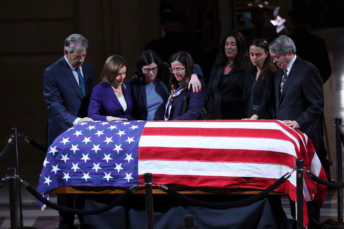 Nancy Pelosi stands with her husband Paul, left, and the family of Senator Dianne Feinstein before a public viewing at San Francisco City Hall in San Francisco on Wednesday, Oct. 4, 2023. (Gabrielle Lurie/San Francisco Chronicle via AP)