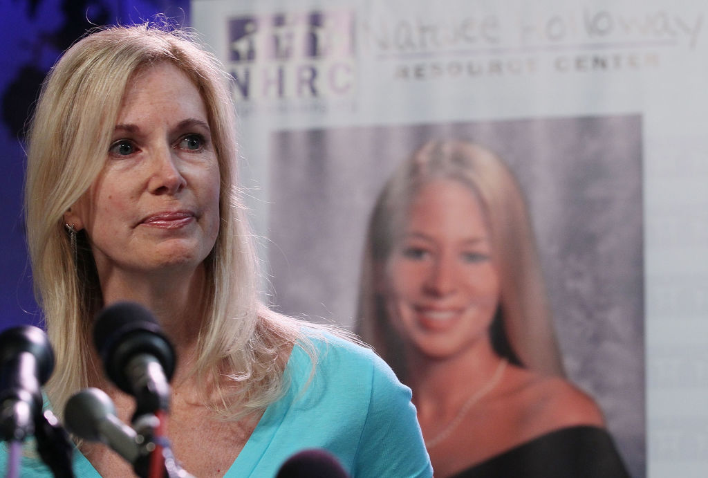 FILE - Beth Holloway fights back tears as she participates in the launch of the Natalee Holloway Resource Center on June 8, 2010 in Washington, D.C.