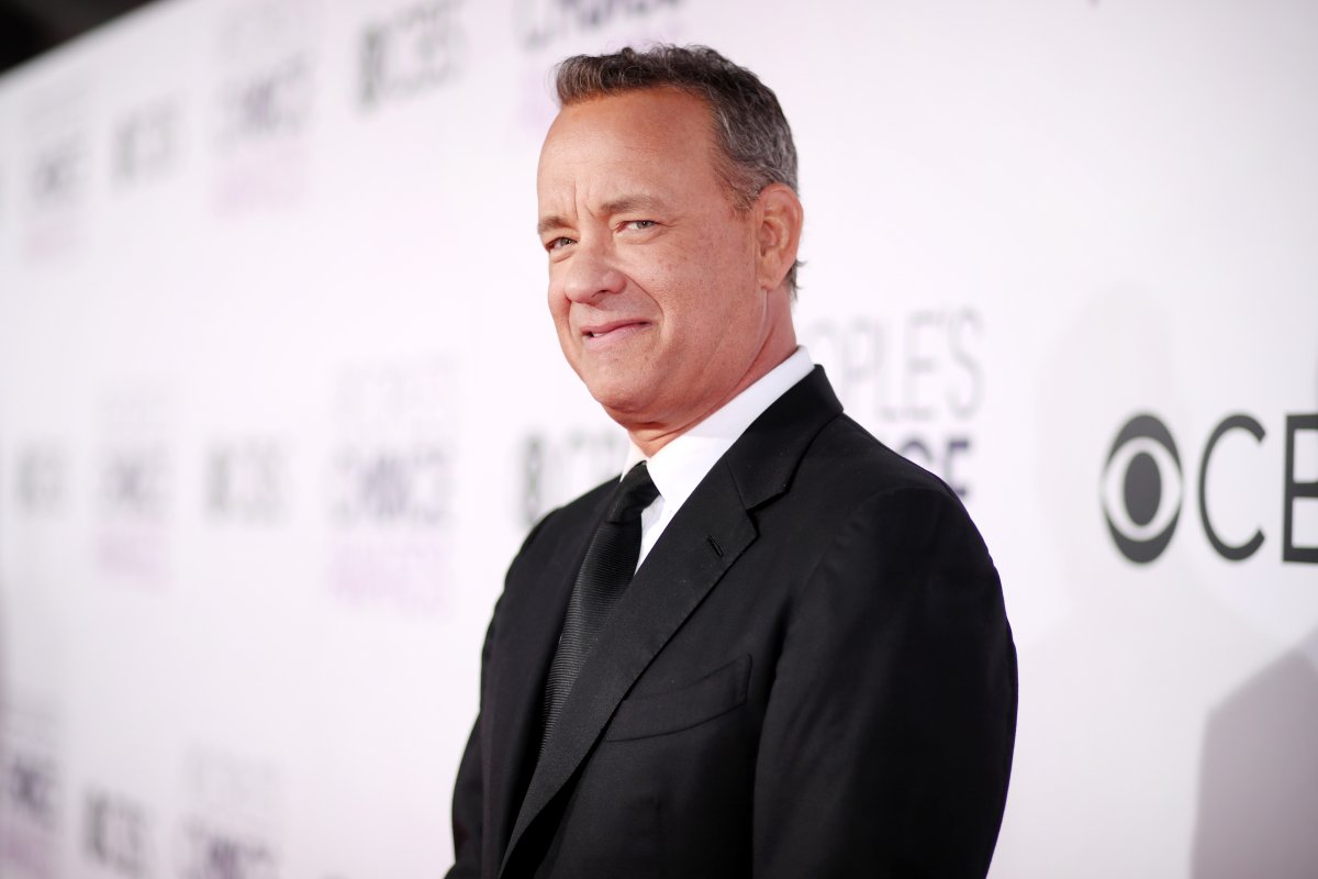 Tom Hanks in a black suit and tie.