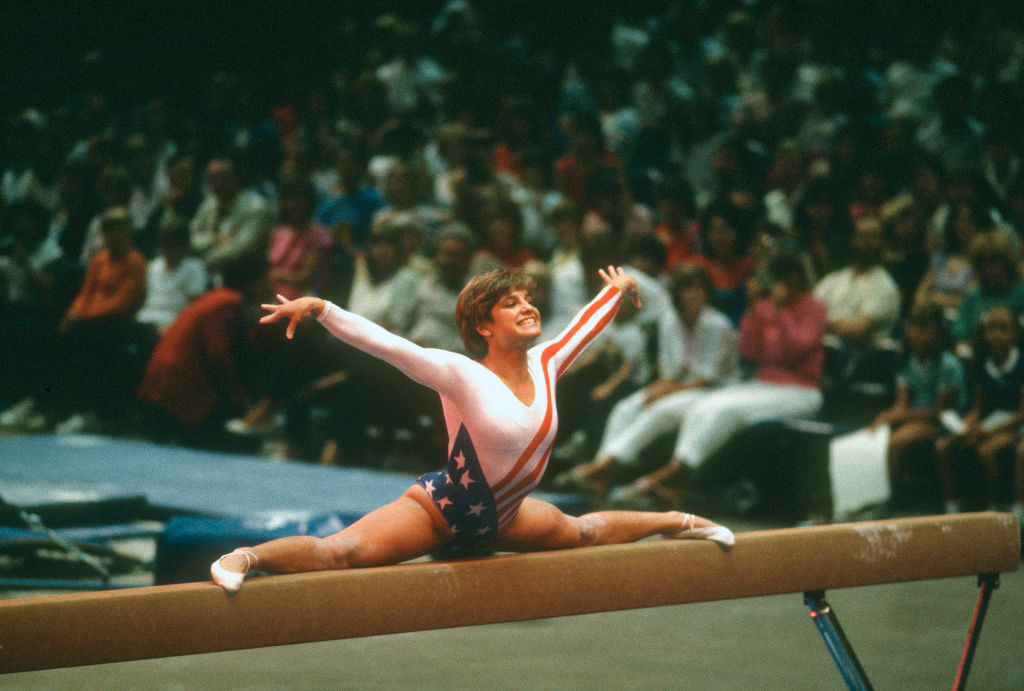 FILE - Gymnast Mary Lou Retton of the United States competes in the balance beam competition in gymnastics during the Games of the XXIII Olympiad in the 1984 Summer Olympics circa 1984 at UCLA's Pauley Pavilion in Los Angeles, Calif.