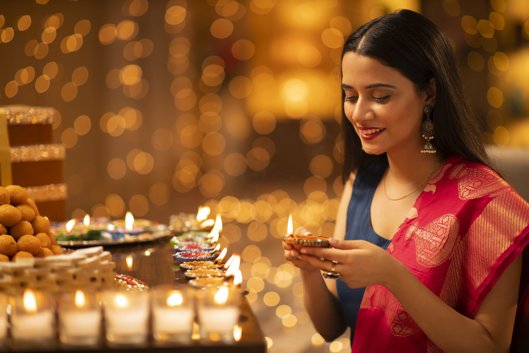 woman celebrates diwali at home