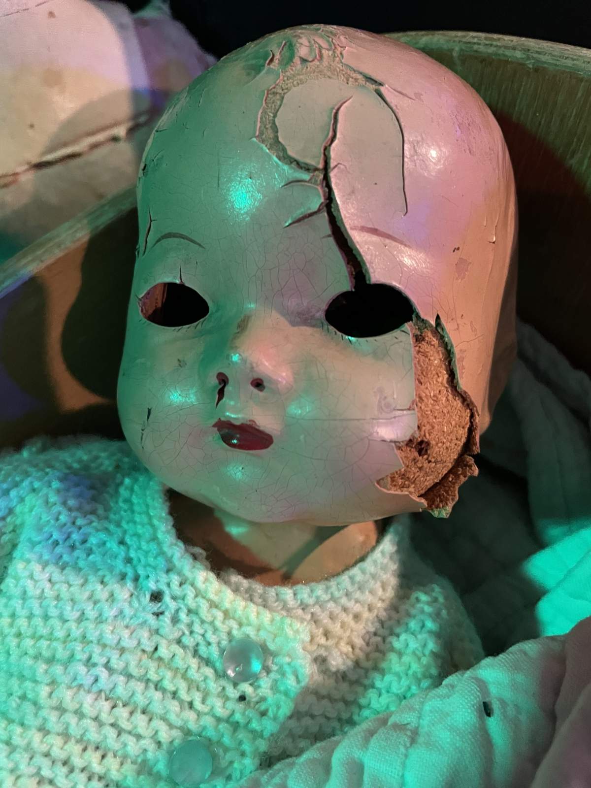 creepy doll crcked face