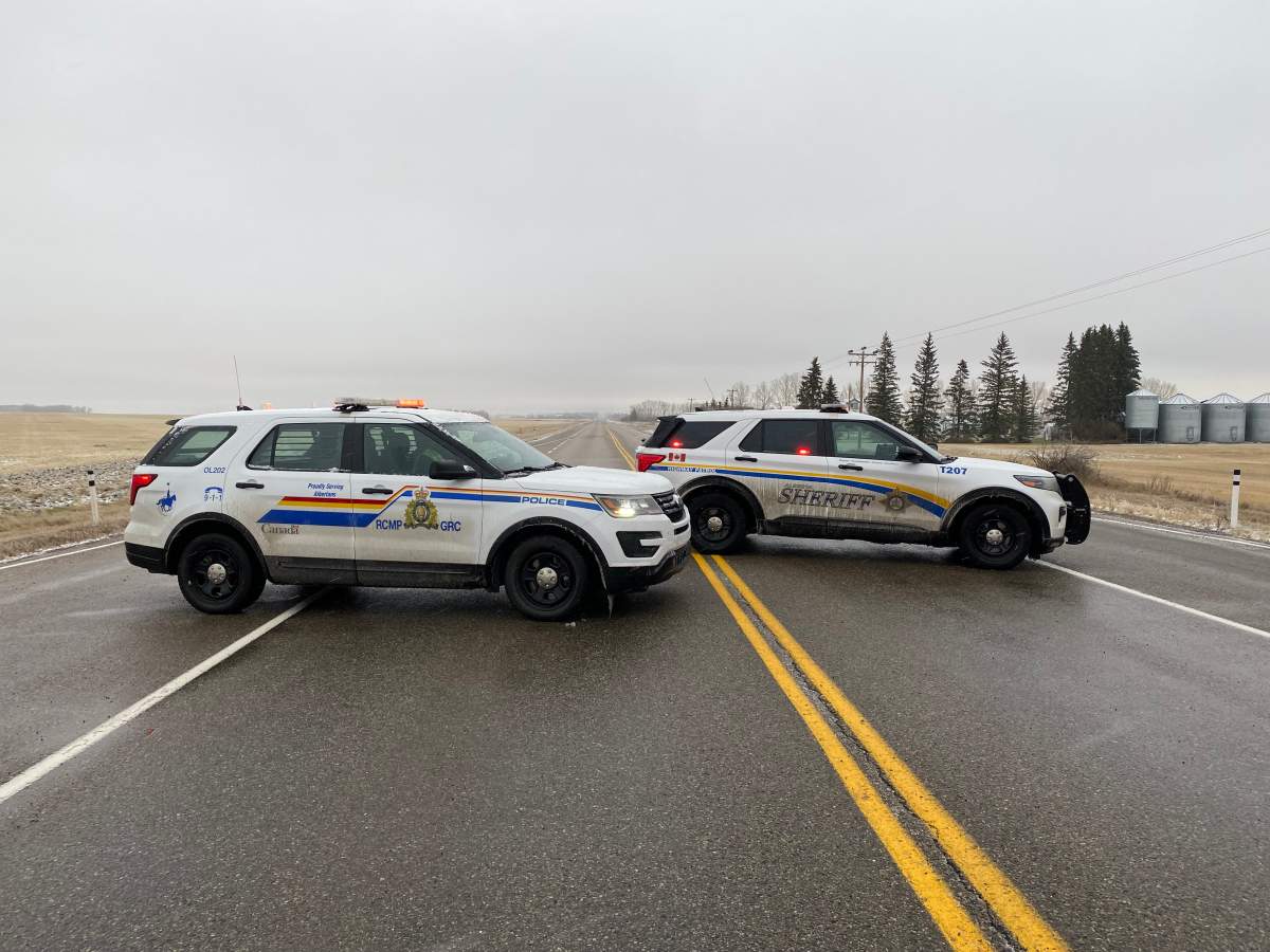 RCMP blocking the road at Highway 2A south of the bus crash scene.