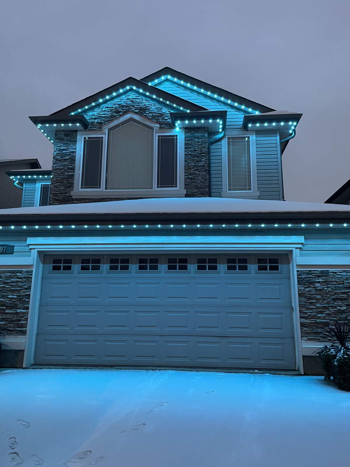 A home that changed their lights to turquoise for dysautonomia awareness.