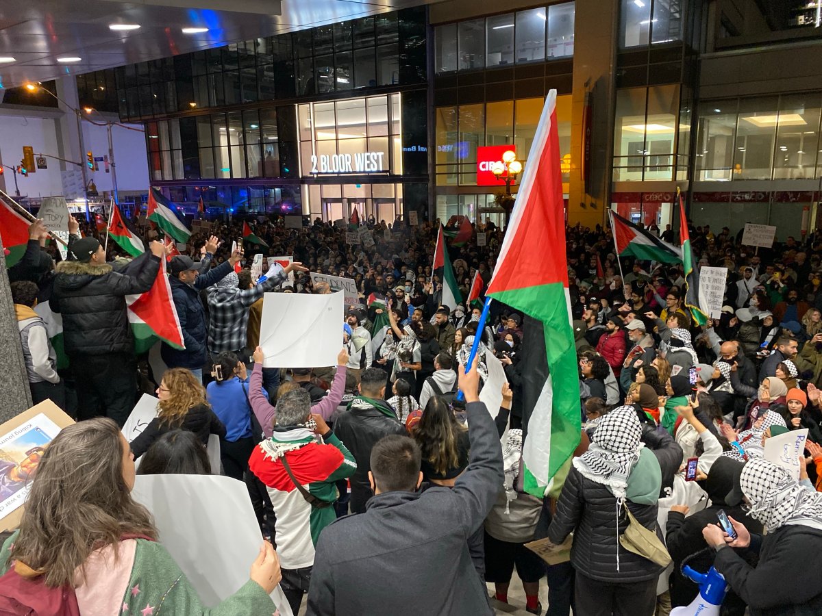 Protestors held Palestinian flags at a downtown Toronto event on Oct. 17, 2023.