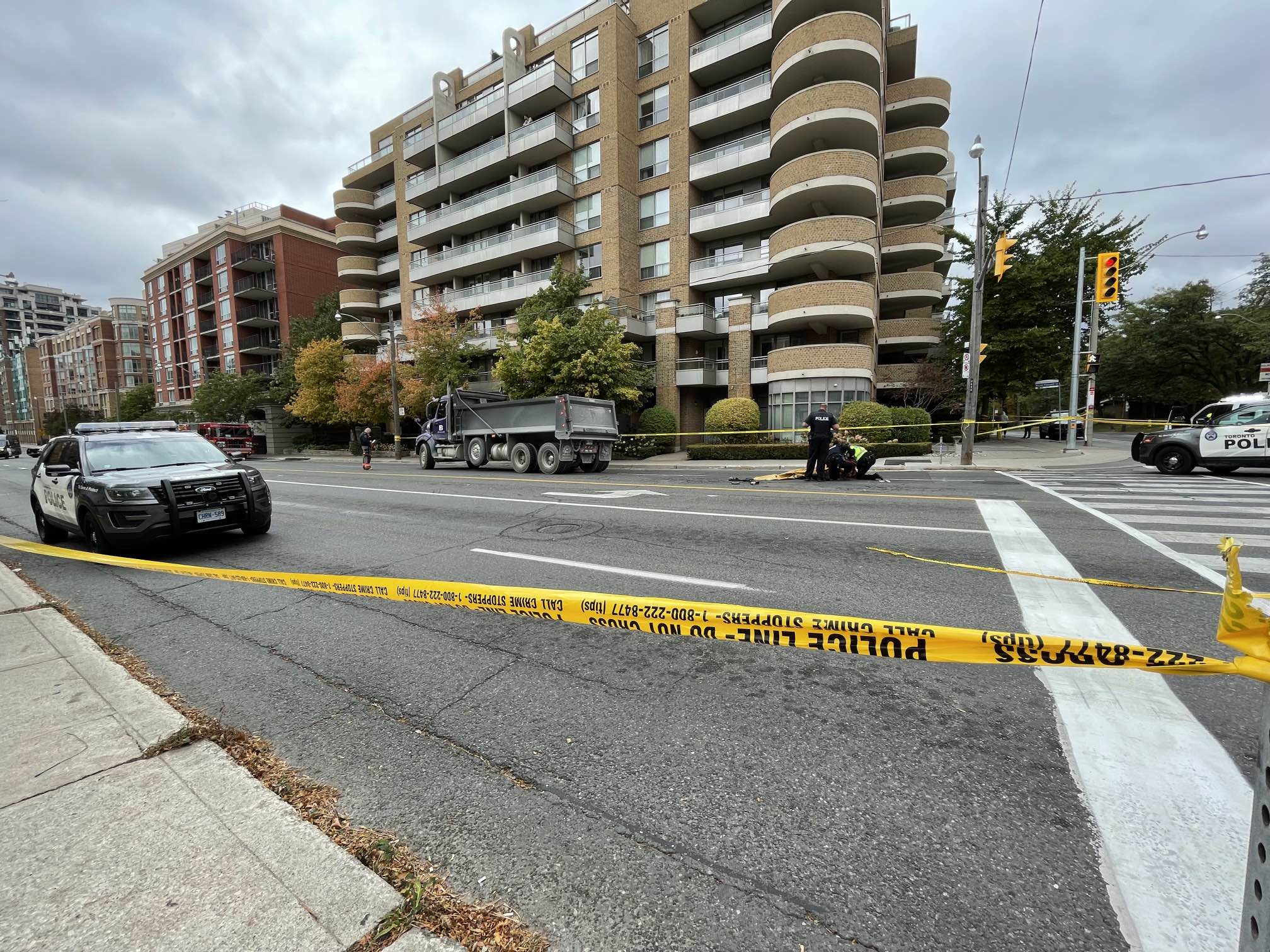 Woman on scooter dead after being hit by dump truck in Toronto