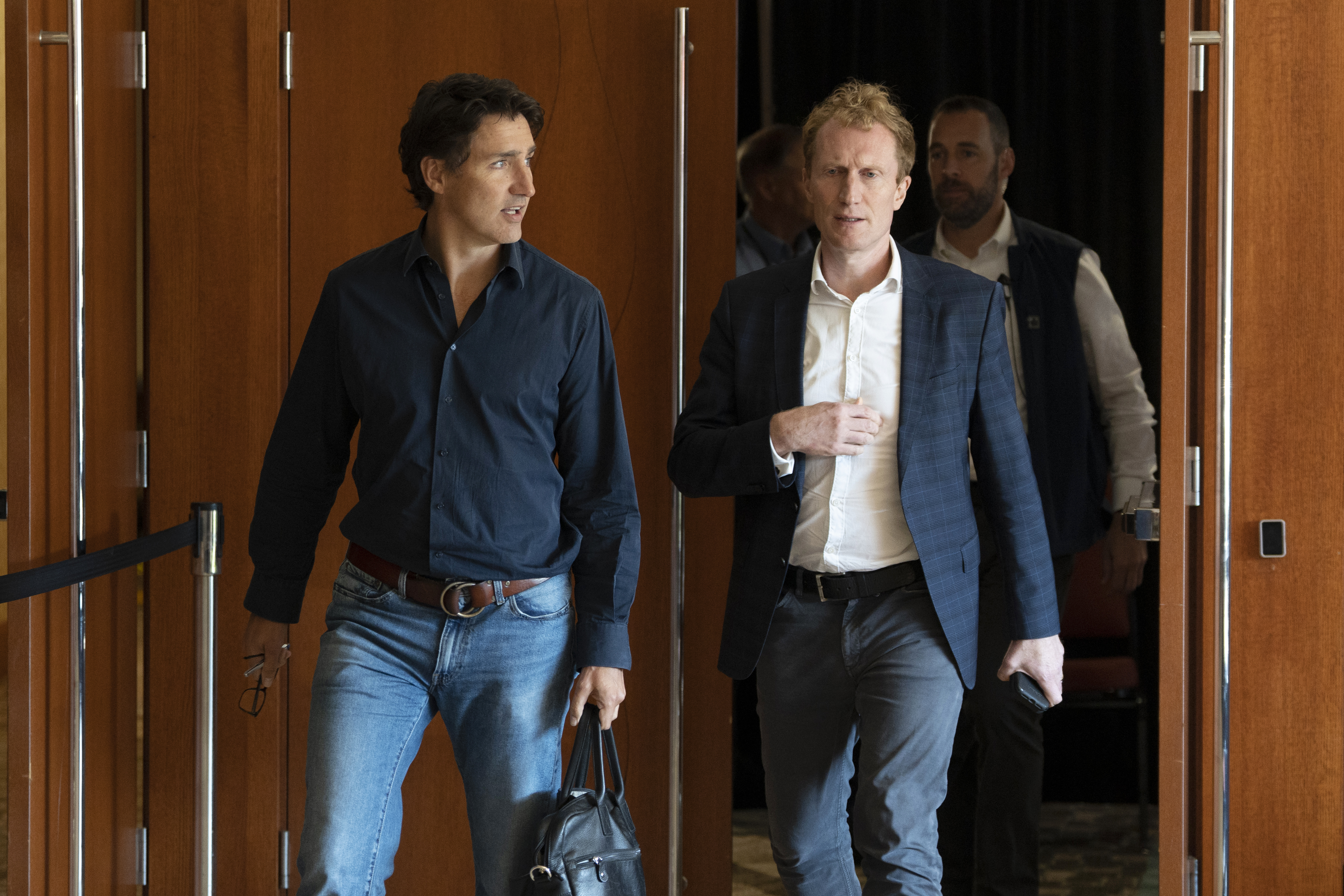 Prime Minister Justin Trudeau, left, and Minister of Immigration, Refugees and Citizenship Marc Miller leave a meeting