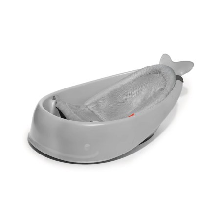 Grey baby bath insert shaped like a whale