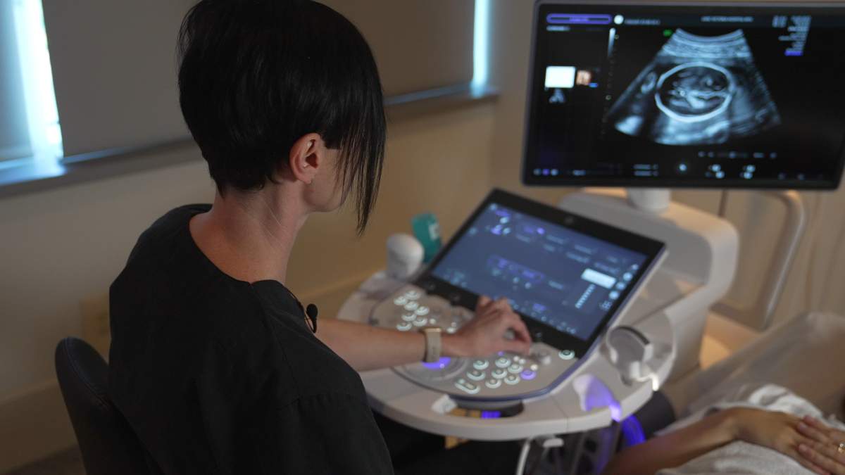 LHSC Sonographer Natasha Quin performing an ultrasound scan with the new units at LHSC.