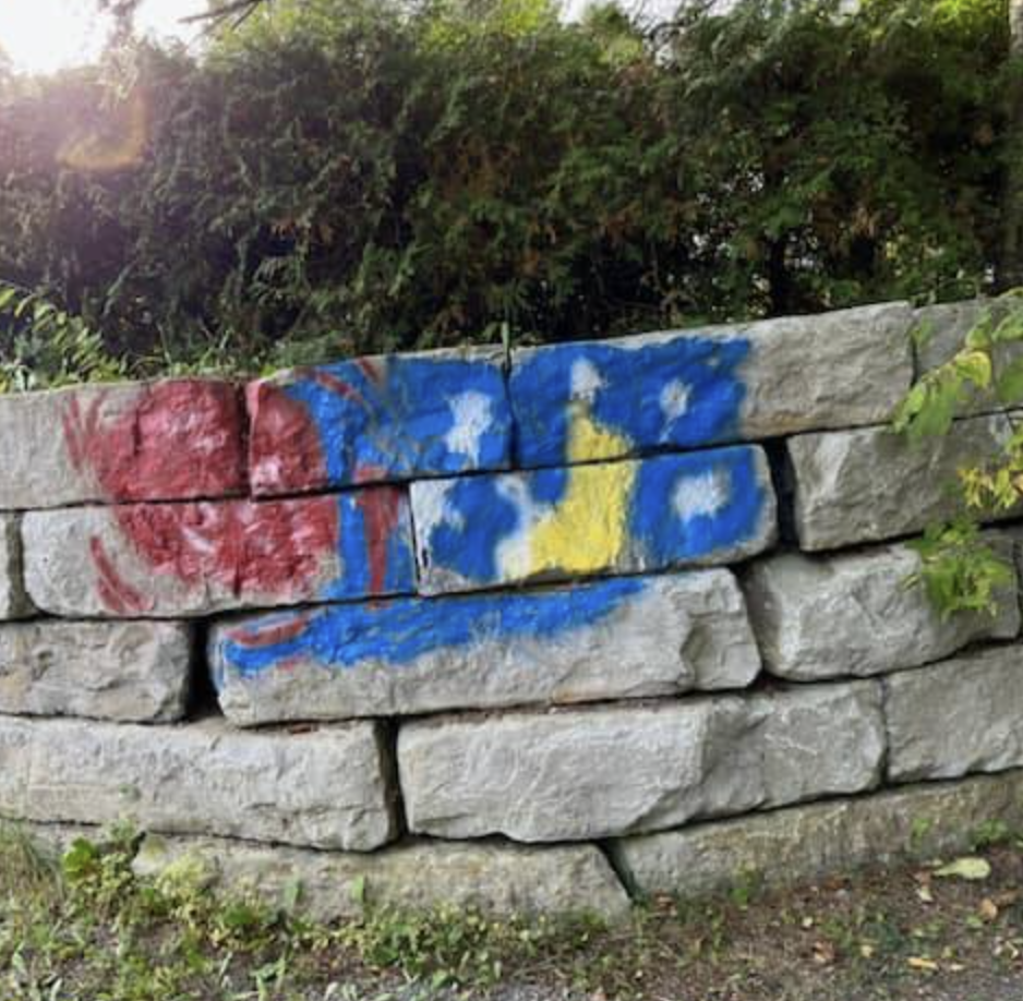 A retaining wall at Union Cemetery in Apsley, Ont., was found spray-painted in late September. OPP say 24 headstones were also tipped over.