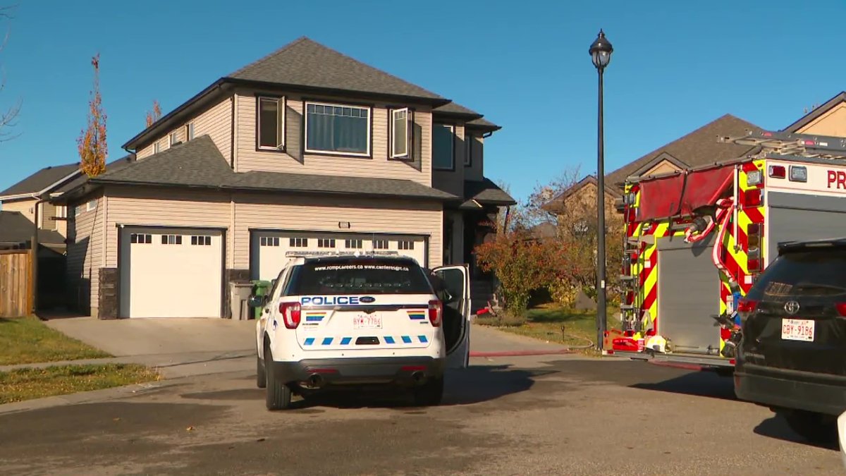 Firefighters and RCMP at the scene of a house fire at 5512 Etoile Court in Beaumont, Alta. on Wednesday, October 18, 2023.