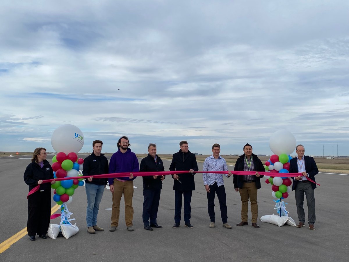 Saskatoon Airport Authority officials reopen the airport's main runway at a ribbon cutting ceremony on Oct. 17, 2023.