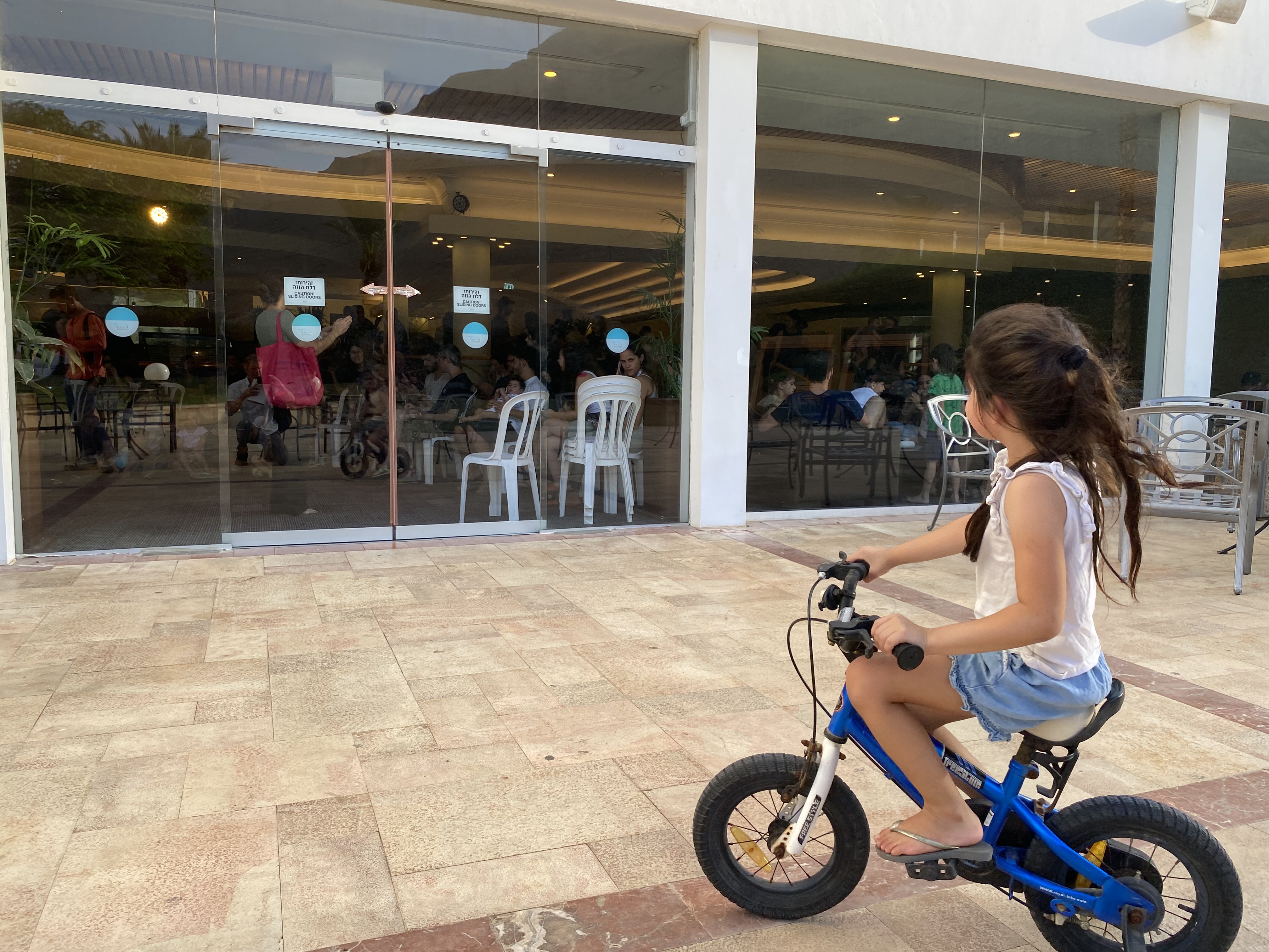 Girl on a bike outside a lounge at the David Dead Sea Resort on Oct. 25.