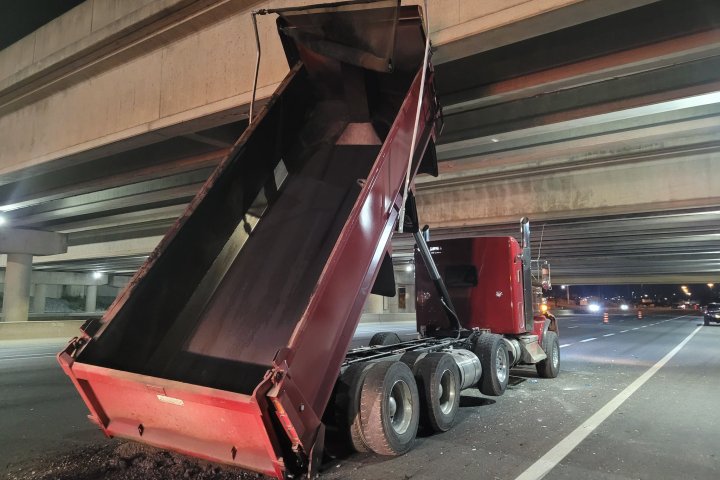 Dump truck with bin up strikes Highway 407 bridge over Highway 404