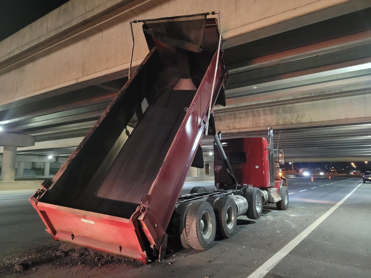 The dump truck with its bin raised at Highway 404 and Highway 407 on Oct. 13, 2023.