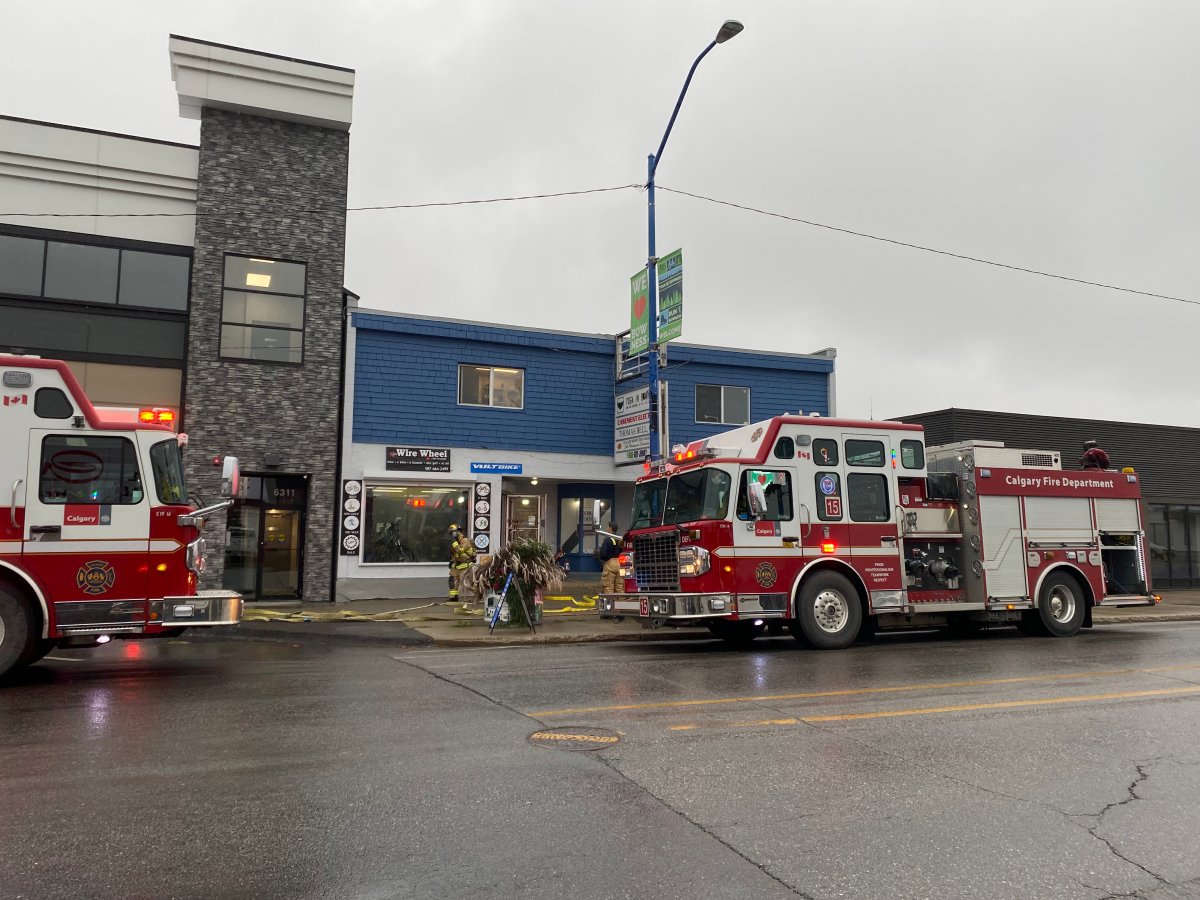 Fire crews at the scene of a Monday afternoon e-scooter battery explosion at a shop on Bowness Road.