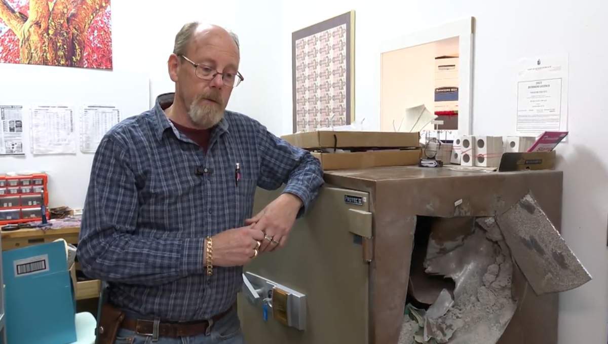 Gold Silver Guy Jeff Ross stands next to a safe that thieves were able to break into at his Qualicum location overnight. 