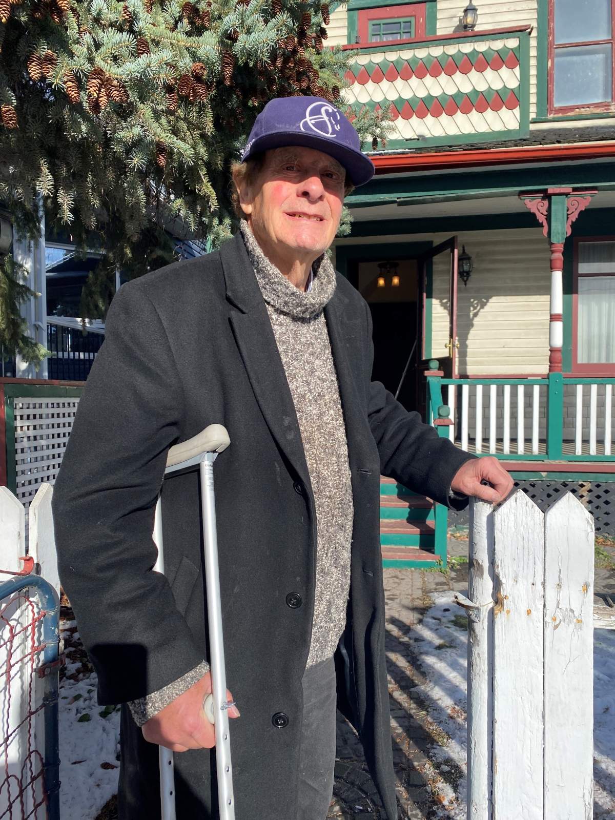 John standing outside of longtime home