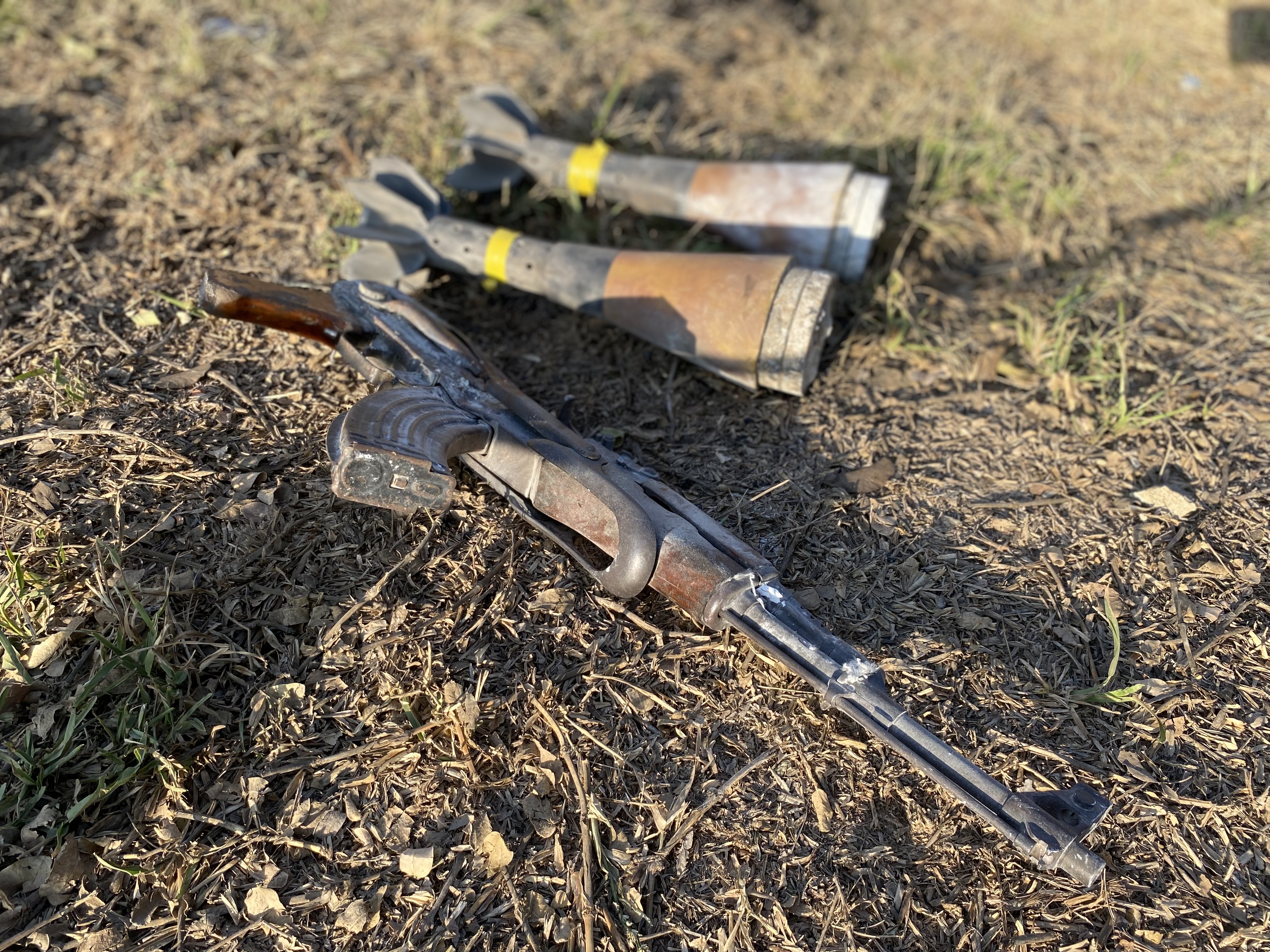 A rifle and rockets lay in Kibbutz Be’eri following an Oct. 7 Hamas attack that killed more than 100.