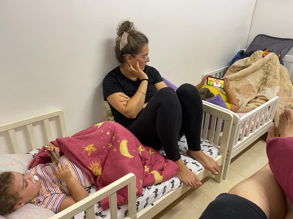 Zehava Hendelman’s daughter and grandaughters in her safe room during the Hamas attack on Sufa, Israel, Oct. 7, 2023.