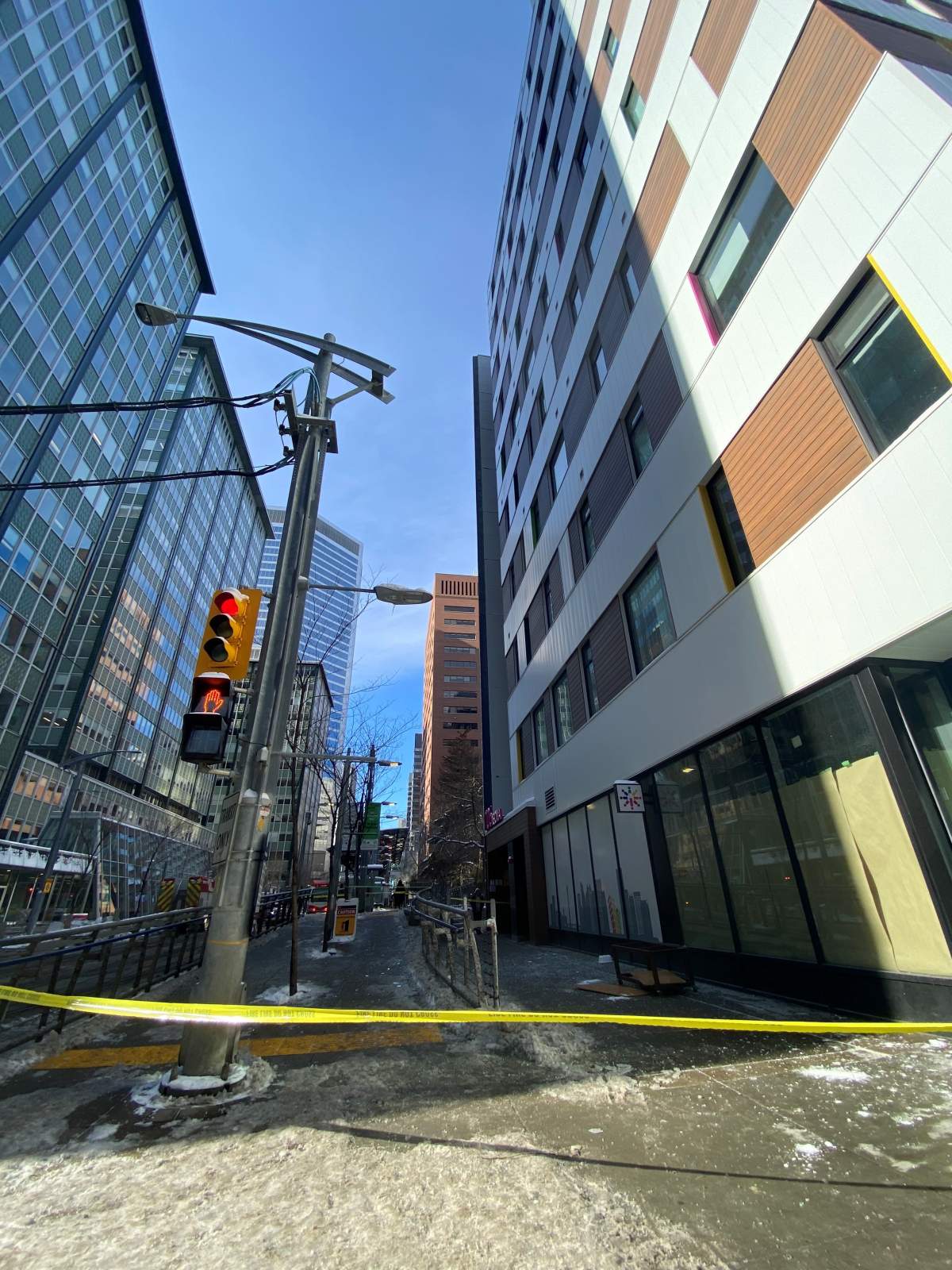 A section of sidewalk on Seventh Avenue Southwest in downtown Calgary was cordoned off on the afternoon of Oct. 27 after a coffee table fell nine storeys and smashed on the pavement.