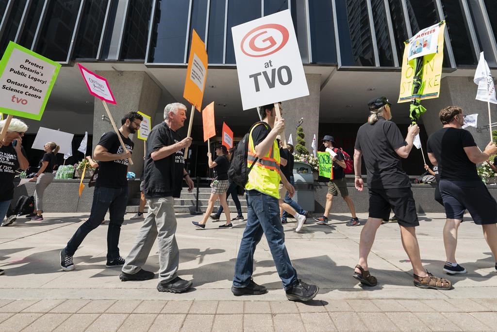 Dozens of workers at Ontario’s public broadcaster ended a strike, reaching a tentative deal with TVO. TVO employees and supporters are seen on the picket line outside of TVO offices Toronto, Monday, Aug. 21, 2023. 
