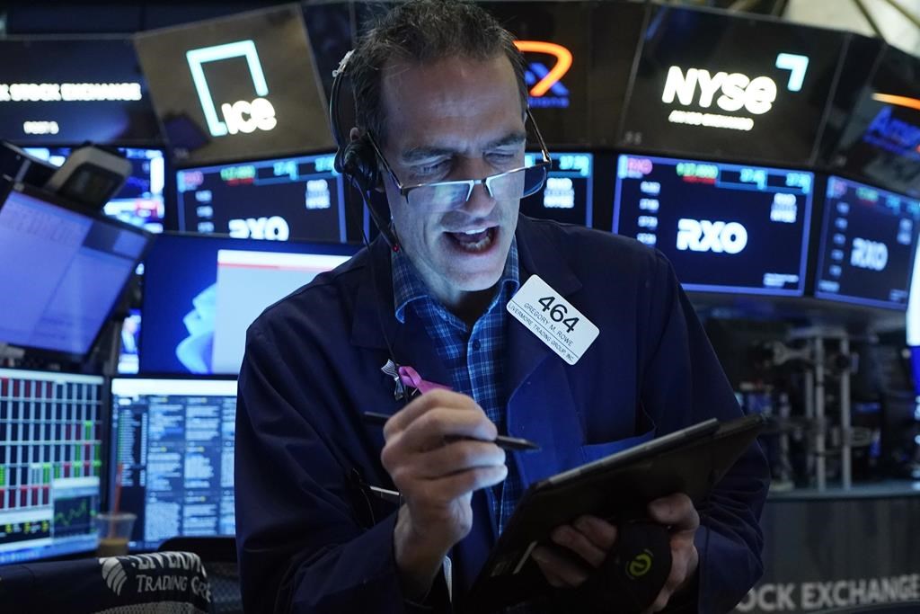 Trader Gregory Rowe works on the floor of the New York Stock Exchange, Wednesday, Nov. 1, 2023.