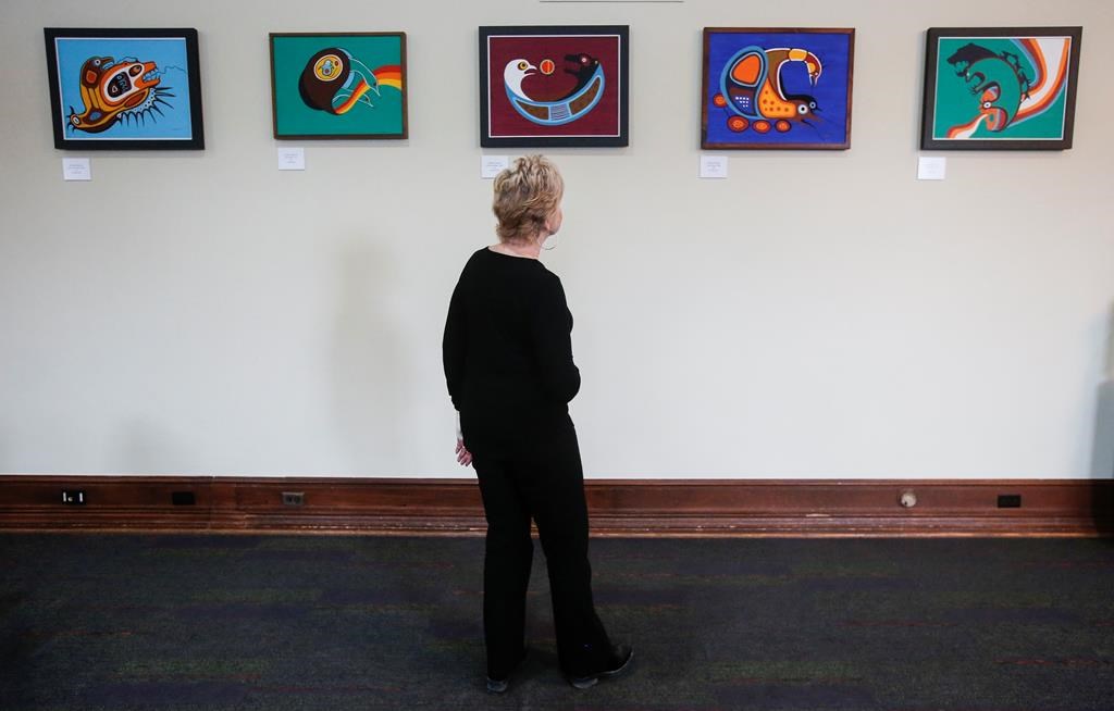 Former Speaker of the Manitoba legislature Myrna Driedger is photographed as she looks at some Jackson Beardy pieces in the new Indigenous art exhibit at the Manitoba legislature in Winnipeg Thursday, Nov. 9, 2023.