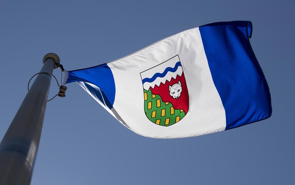The Northwest Territories provincial flag flies on a flagpole in Ottawa on Monday July 6, 2020. Residents of the Northwest Territories are heading to the polls today, more than a month after the election was originally set to be held. THE CANADIAN PRESS/Adrian Wyld.