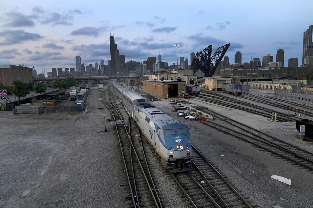 An Amtrak passenger train departs Chicago on Wednesday, Sept. 14, 2022, in Chicago. Amtrak is making a sales pitch to connect its lines in Detroit to Via Rail tracks across the border, hoping to lay the ground for passenger service between Toronto and Chicago.