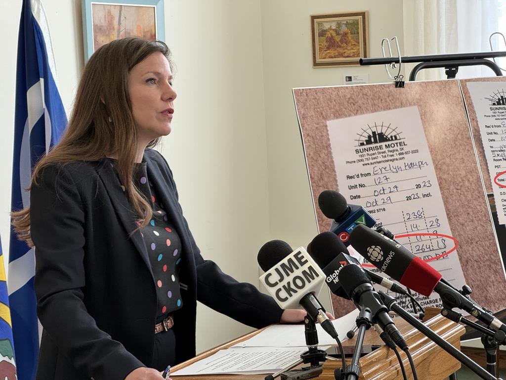 Meara Conway, the Saskatchewan Opposition NDP social services critic, speaks to reporters in Regina on Wednesday, Nov. 15, 2023, over accusations that a motel owned by a Saskatchewan Party legislature member raised rates for a social assistance client. THE CANADIAN PRESS/Jeremy Simes.