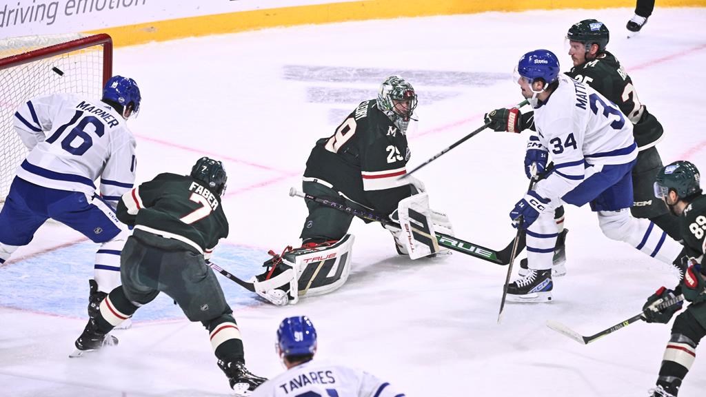 Toronto’s Auston Matthews, right, scores at Minnesota’s goalkeeper Marc-Andre Fleury during the NHL Global Series Sweden ice hockey match between Toronto Maple Leafs and Minnesota Wild at Avicii Arena in Stockholm, Sweden, Sunday, Nov. 19, 2023.(Claudio Bresciani/TT via AP)