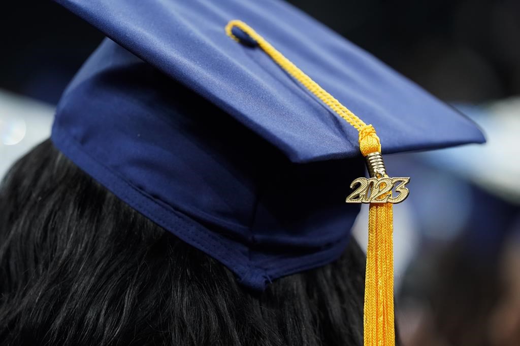 <div>Ontario's colleges want the province to immediately end its five-year-long tuition freeze. A tassel with 2023 on it rests on a graduation cap as students walk in a procession for Howard University's commencement in Washington, Saturday, May 13, 2023. </div>.