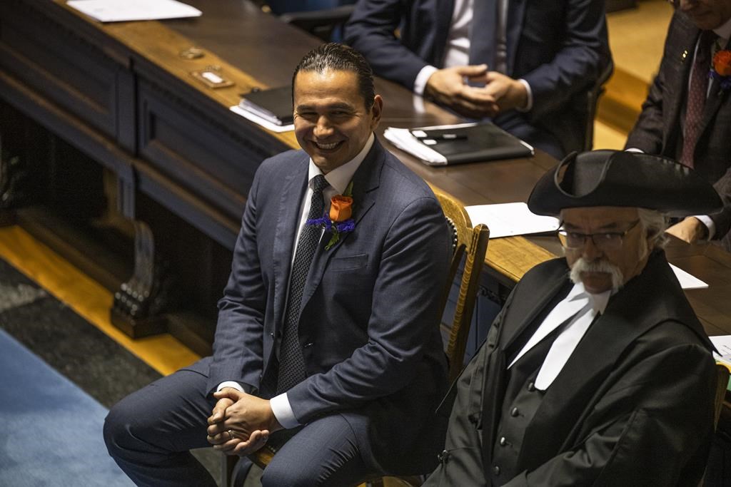 The new NDP government in Manitoba is reconsidering a plan to build nine new schools started by the previous Progressive Conservative government. Manitoba Premier Wab Kinew is seen in the legislative assembly during the first session of the 43rd Manitoba legislature throne speech at the Manitoba Legislative Building in Winnipeg, Tuesday, Nov. 21, 2023. THE CANADIAN PRESS/Aaron Vincent Elkaim.