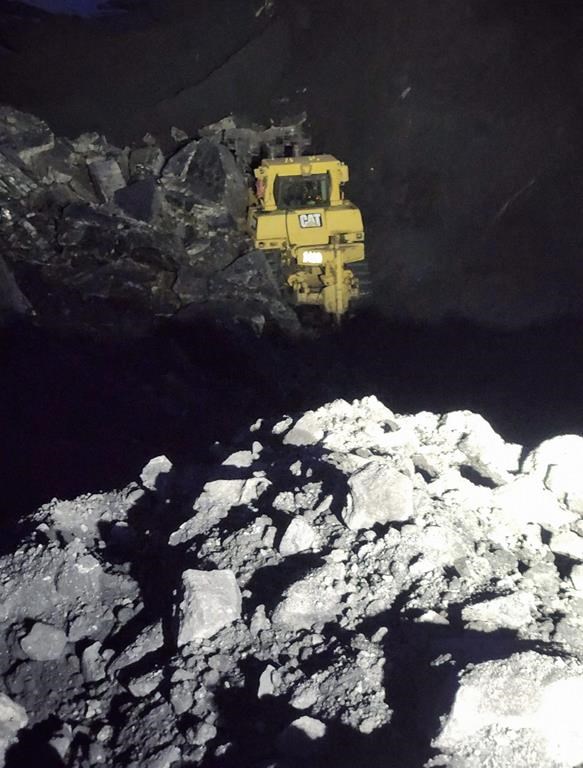An environmental group says a coal company's application to deepen its open-pit mine shouldn't be considered while it's under investigation for wrongly releasing wastewater into local rivers. A dozer operated in the CST Coal mine in Grand Cache, Alta., was partially buried in an October 2022 "wall instability." The operator was unhurt.