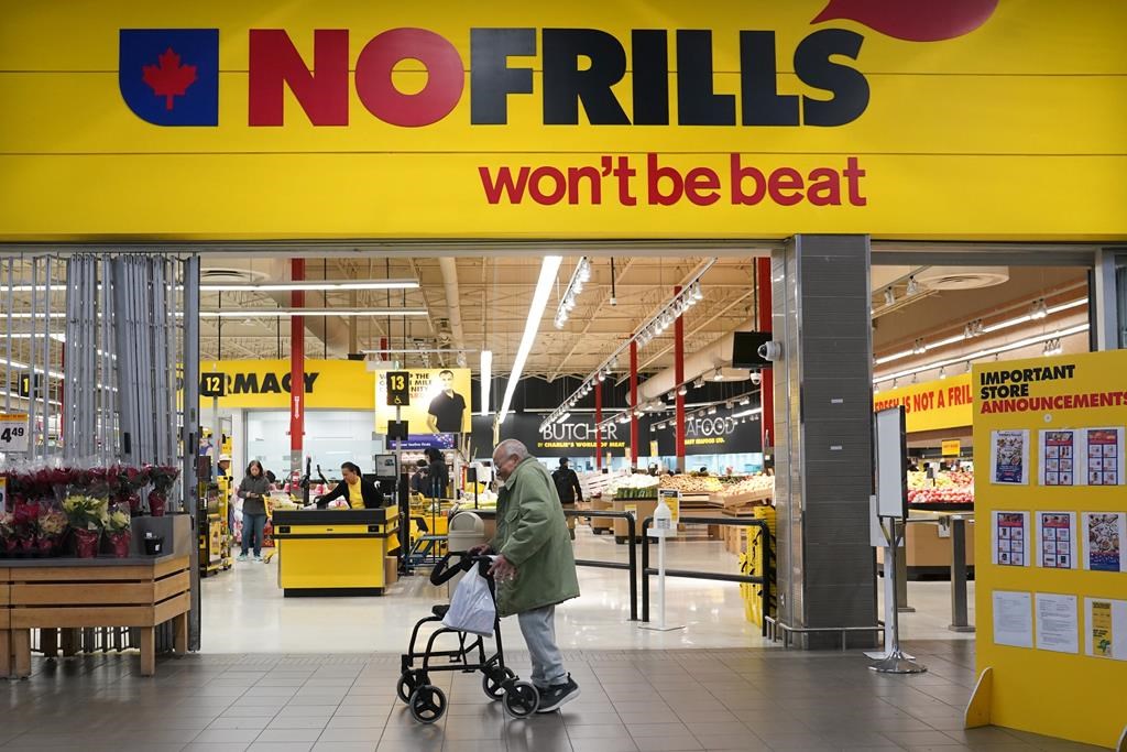 Unifor says No Frills workers at 17 stores in Ontario have ratified their new collective agreement. A person walks past a No Frills grocery store in Toronto, on Thursday, November 23, 2023.THE CANADIAN PRESS/Chris Young.
