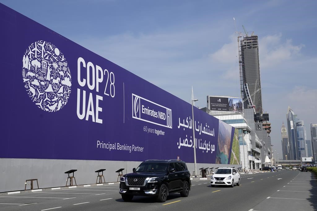 Cars pass by a billboard advertising COP28 at Sheikh Zayed highway in Dubai, United Arab Emirates. THE CANADIAN PRESS/AP-Kamran Jebreili.