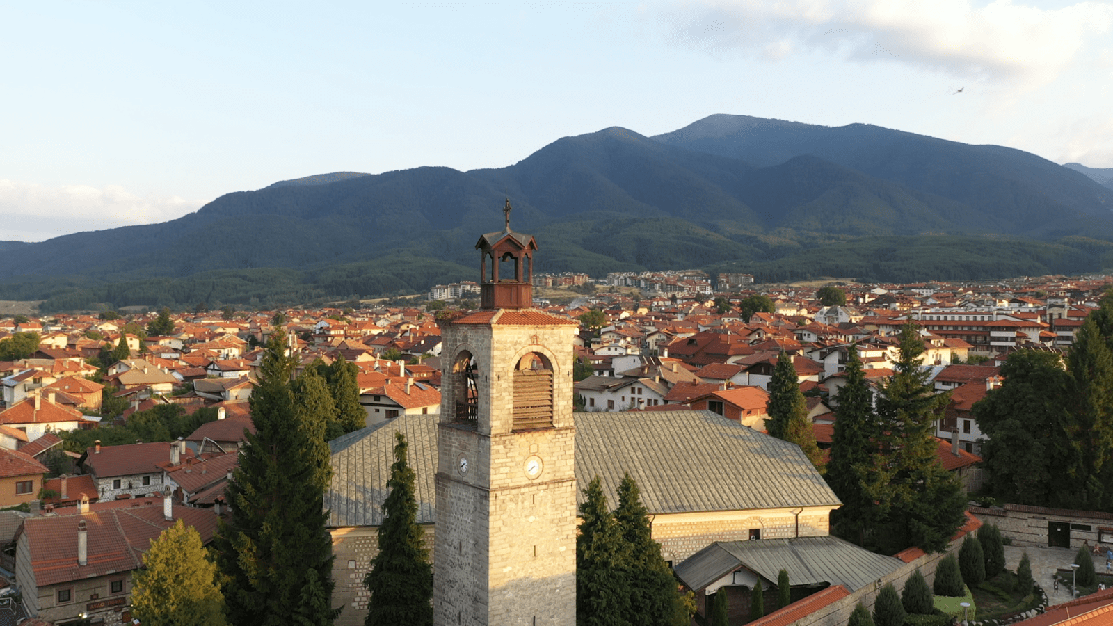 The bell tower of The Holy Trinity Orthodox Church in Bansko at sunset.