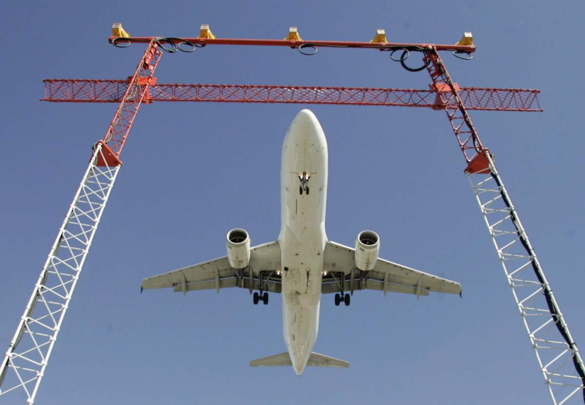 An Air Canada flight makes its final approach as it lands at Pearson International Airport in Toronto on Sept. 30, 2004. 