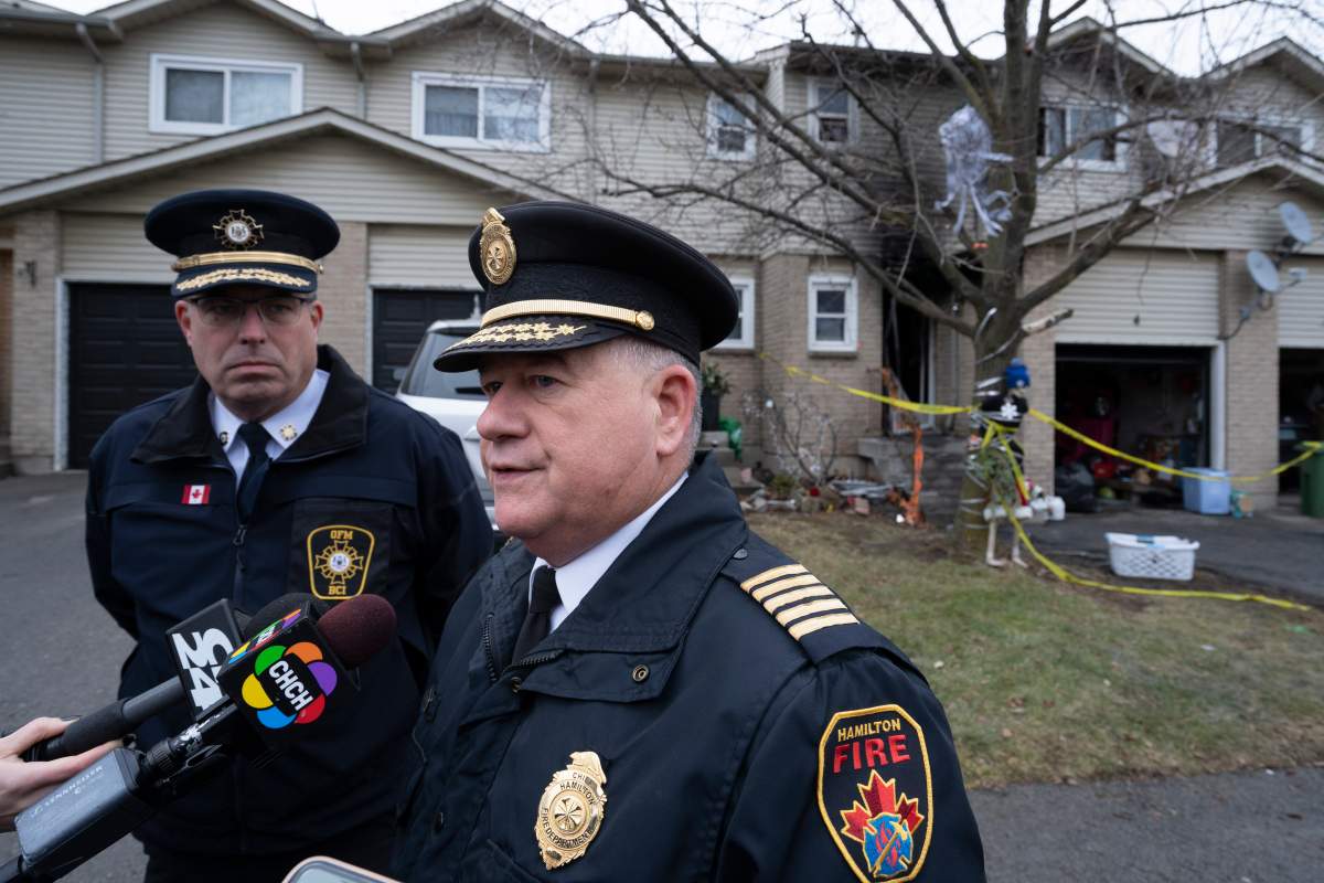 Hamilton Fire Chief Dave Cunliffe speaks to the media in Hamilton, Ont. on Friday, Dec. 30, 2022, following a fatal blaze that claimed the lives of two adults and two children. THE CANADIAN PRESS/Peter Power