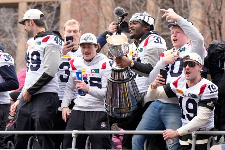 Montreal Alouettes hoist Grey Cup through the streets in downtown parade