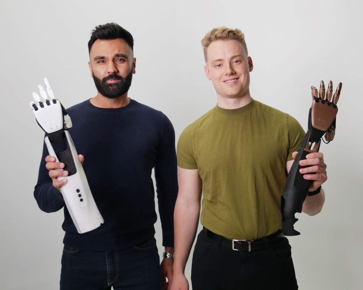 Hamayal Choudhry (left) and Evan Neff (right) holding smartARM prototypes. The startup is dedicated to empowering people with limb differences.