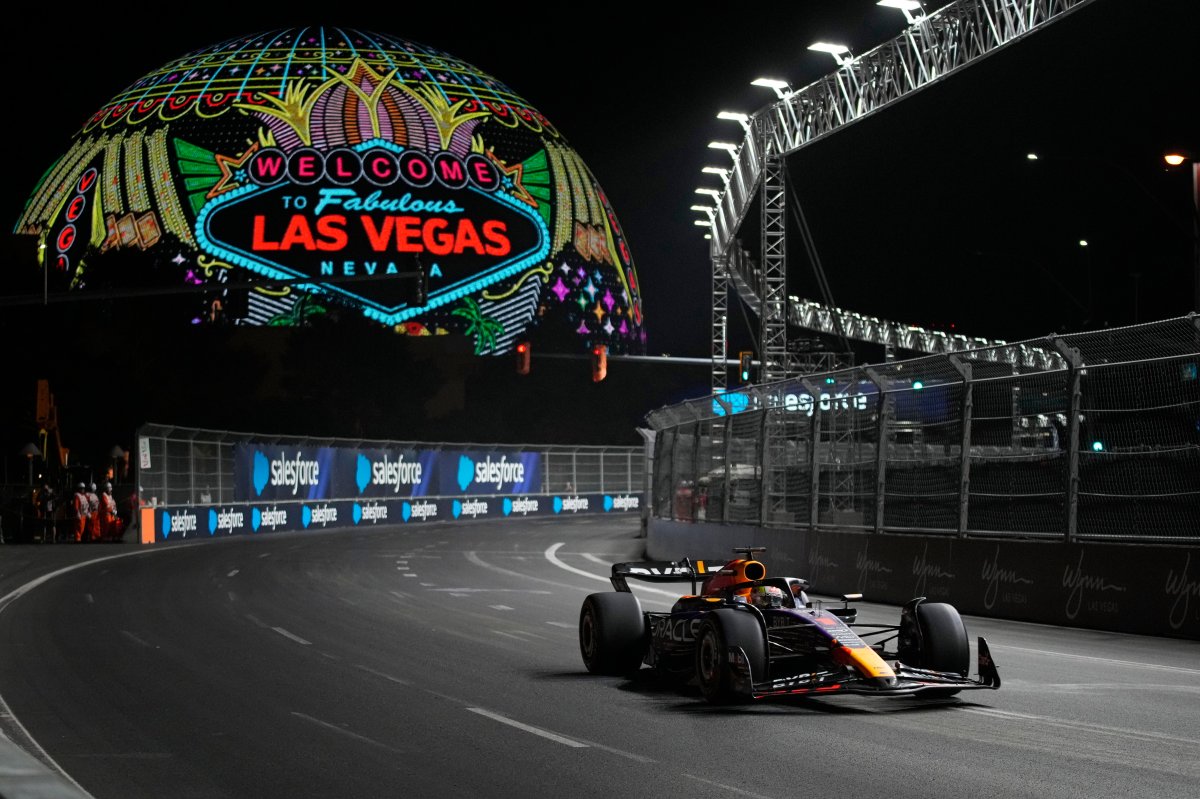 Red Bull driver Max Verstappen drives around a corner during the final practice session on Friday for Formula 1’s Las Vegas Grand Prix. In the background is The Sphere.