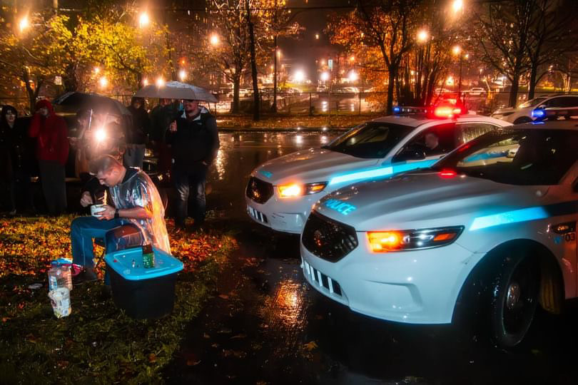 Flanked by police cars, Riley Merry managed to devour nearly four pounds of potato salad Saturday evening.