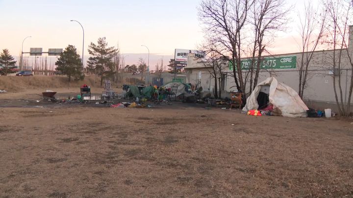 Edmonton police seek suspect after woman with stab wound found at scene of encampment fire