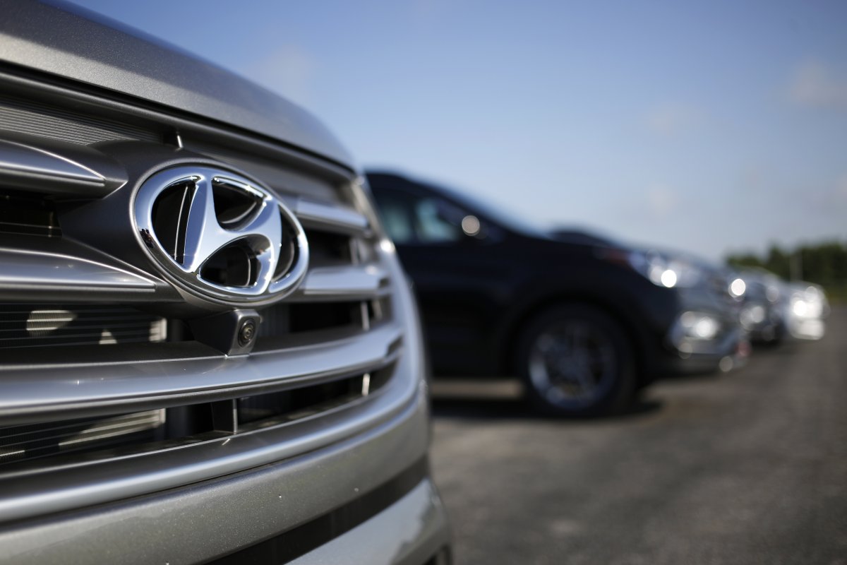 The Hyundai Motor Co. logo is seen on the front grill of a Santa Fe sports utility vehicle (SUV) at the Hyundai Motor Manufacturing Alabama (HMMA) facility in Montgomery, Alabama, U.S., on Wednesday, July 19, 2017. 