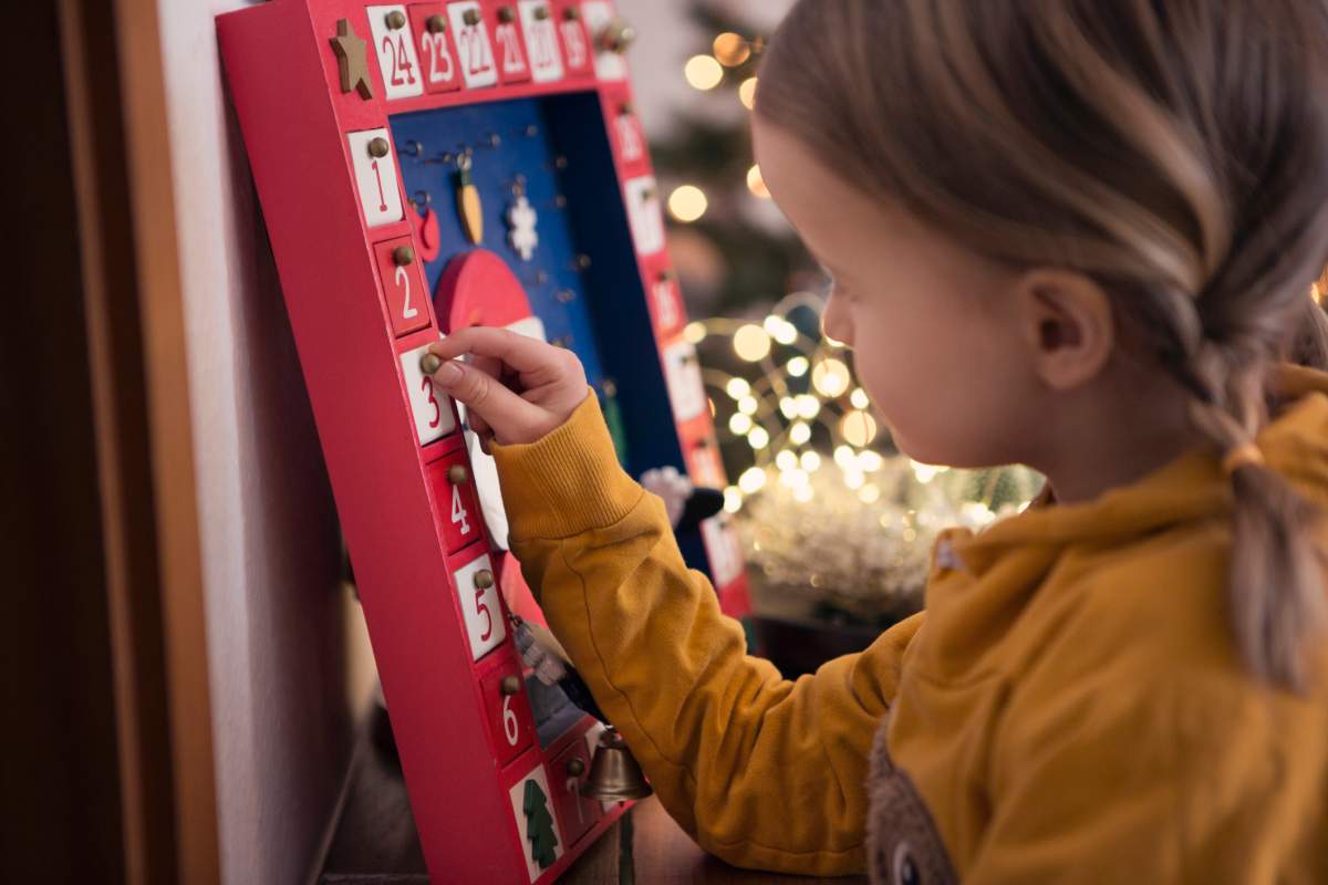 Girl opens advent calendar