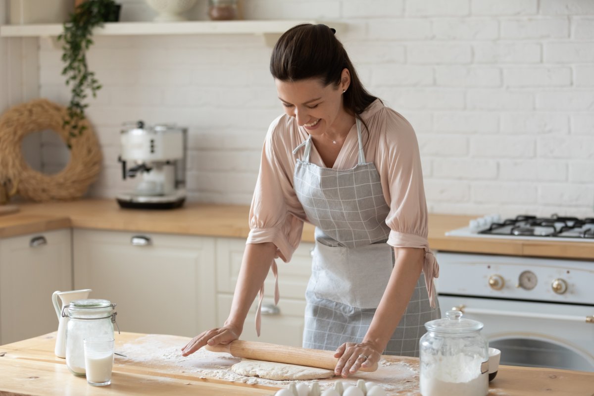 woman kneading dough in the kitchen